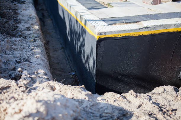 Professional Basement Waterproofing technician working in Hazel Green, AL